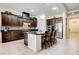 Kitchen featuring a center island with bar seating, dark cabinetry, and stainless steel appliances at 3518 W Agate Ave, Las Vegas, NV 89139