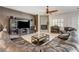 Elegant living room featuring a decorative fireplace, tiled flooring, and stylish furnishings at 3518 W Agate Ave, Las Vegas, NV 89139