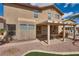 Back of home featuring a covered patio and backyard with artificial turf at 3800 Crema Ct, Las Vegas, NV 89129