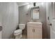 Half-bathroom has a stylish vanity with a modern sink at 3800 Crema Ct, Las Vegas, NV 89129