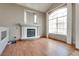 Bright living room features hardwood floors, a fireplace and a large picture window at 3800 Crema Ct, Las Vegas, NV 89129