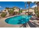 Backyard pool surrounded by desert landscaping, perfect for relaxation and enjoying the outdoors at 3800 Crema Ct, Las Vegas, NV 89129