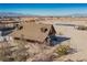 Aerial view showcases the expansive property, including a log home with a rural charm at 3900 W Landberg Ave, Las Vegas, NV 89141