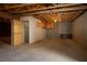 Unfinished basement features exposed ductwork and an open door to a large area at 3900 W Landberg Ave, Las Vegas, NV 89141