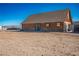 Spacious log cabin with dirt landscaping, ideal for rural living and outdoor adventures at 3900 W Landberg Ave, Las Vegas, NV 89141