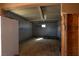 Interior of a garage space with metal walls, wooden floors, and ample sunlight at 3900 W Landberg Ave, Las Vegas, NV 89141