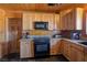 Cozy kitchen features wooden cabinets, granite countertops, and modern appliances at 3900 W Landberg Ave, Las Vegas, NV 89141