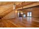 Open-concept living space with wood paneled walls, staircase, and hardwood floors at 3900 W Landberg Ave, Las Vegas, NV 89141