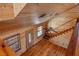 Rustic open-concept living room with wood-paneled walls, hardwood floors, and natural light at 3900 W Landberg Ave, Las Vegas, NV 89141