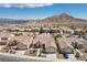 Aerial view of the residential community showcasing the landscape, desert mountain views, and neighborhood streets at 4416 Peaceful Morning Ln, Las Vegas, NV 89129
