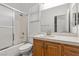 Bathroom featuring a shower, vanity, toilet, and tile floors at 4416 Peaceful Morning Ln, Las Vegas, NV 89129