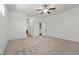 A spacious bedroom with neutral carpet and natural light from the windows at 4416 Peaceful Morning Ln, Las Vegas, NV 89129