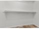 A practical closet design with a shelf and hanging rod for clothes at 4416 Peaceful Morning Ln, Las Vegas, NV 89129