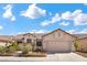 Inviting single-story house featuring well-maintained landscaping and a two-car garage at 4416 Peaceful Morning Ln, Las Vegas, NV 89129