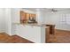 Charming kitchen featuring a breakfast bar and island, blending functionality with a welcoming atmosphere at 4416 Peaceful Morning Ln, Las Vegas, NV 89129