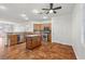 Open kitchen features stainless steel appliances, granite counters, and kitchen island at 4416 Peaceful Morning Ln, Las Vegas, NV 89129