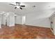 Spacious open-concept living room with fireplace and seamless flow to the kitchen featuring stainless steel appliances at 4416 Peaceful Morning Ln, Las Vegas, NV 89129