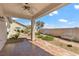 Covered patio area with desert landscaping, brick pathway, and seating at 4416 Peaceful Morning Ln, Las Vegas, NV 89129