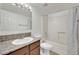 Well-lit bathroom with granite countertop, shower and tub with tile surround at 5170 S Jones Blvd # 205, Las Vegas, NV 89118