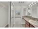 Bright bathroom features a granite countertop vanity and a mirrored medicine cabinet at 5170 S Jones Blvd # 205, Las Vegas, NV 89118