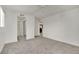 Bedroom with carpeted floors, ceiling fan, closet, and a view of the kitchen at 5170 S Jones Blvd # 205, Las Vegas, NV 89118