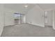 Spacious bedroom featuring sliding glass doors, neutral carpet, and plenty of natural light at 5170 S Jones Blvd # 205, Las Vegas, NV 89118