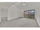 Bright bedroom features sliding glass doors, neutral carpet, and plenty of natural light at 5170 S Jones Blvd # 205, Las Vegas, NV 89118