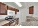 Traditional kitchen featuring granite countertops and stainless steel oven, microwave, and a white refrigerator at 5170 S Jones Blvd # 205, Las Vegas, NV 89118