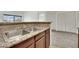 Kitchen sink overlooking Gathering room featuring granite countertops, stainless steel sink and large window views at 5170 S Jones Blvd # 205, Las Vegas, NV 89118