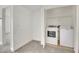 Bright laundry room features white washer and dryer, neutral walls and carpeted floor at 5170 S Jones Blvd # 205, Las Vegas, NV 89118
