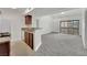 Open concept living room with view of modern kitchen and sliding glass doors to a patio or balcony at 5170 S Jones Blvd # 205, Las Vegas, NV 89118