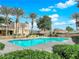 Bright community pool features lounge seating, nearby palm trees and green bushes at 5170 S Jones Blvd # 205, Las Vegas, NV 89118