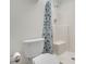 Bathroom featuring a white toilet and shower with a leaf patterned shower curtain at 5170 S Jones Blvd # 205, Las Vegas, NV 89118
