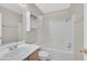 Clean bathroom with a tub and shower combination, white tile surround, and a vanity at 5331 Heatherbrook Cir, Las Vegas, NV 89120