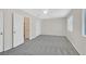 Spacious bedroom features plush carpeting, neutral paint, and ample natural light from the windows at 5331 Heatherbrook Cir, Las Vegas, NV 89120