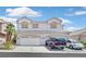 Charming two-story home with a tile roof, three-car garage, and well-maintained landscaping at 5331 Heatherbrook Cir, Las Vegas, NV 89120