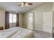 Spacious bedroom with a window, closet, and doorway to the bathroom at 5437 Escallonia St, Las Vegas, NV 89149