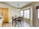 Cozy dining area featuring tile floors, bay windows, and an ornate chandelier at 5437 Escallonia St, Las Vegas, NV 89149