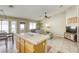 Bright kitchen with breakfast bar seating open to living area at 5437 Escallonia St, Las Vegas, NV 89149