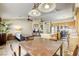 Open-concept living area with a view of the kitchen and a ceiling fan at 5437 Escallonia St, Las Vegas, NV 89149