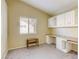 Dedicated office space featuring a built in desk, storage cabinets and a window at 5437 Escallonia St, Las Vegas, NV 89149