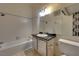 The bathroom has a tub/shower combo, toilet, and sink with a large mirror at 5526 Orchard Ln # 0, Las Vegas, NV 89110