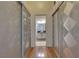 Hallway with unique sliding closet doors leading to the bathroom at 5526 Orchard Ln # 0, Las Vegas, NV 89110