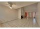 Living room featuring a ceiling fan, access to a balcony, and a fireplace at 5526 Orchard Ln # 0, Las Vegas, NV 89110
