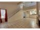 Spacious living area with access to the kitchen, staircase, and private patio at 5526 Orchard Ln # 0, Las Vegas, NV 89110