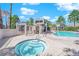 Community pool area with hot tub, swimming pool, and covered picnic area at 5526 Orchard Ln # 0, Las Vegas, NV 89110