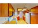 Cozy kitchen with vintage appliances and natural wood cabinets at 6397 Kell Ln, Las Vegas, NV 89156