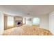 Bright living room with a brick fireplace, and neutral carpet at 6397 Kell Ln, Las Vegas, NV 89156