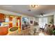 Open-concept living space with kitchen access and sliding glass doors to the exterior at 6397 Kell Ln, Las Vegas, NV 89156