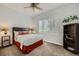 Cozy bedroom showcasing natural light, a bed, and a bookshelf for added storage at 64 Chateau Whistler Ct, Las Vegas, NV 89148